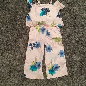 Pink jumpsuit with green and blue flowers